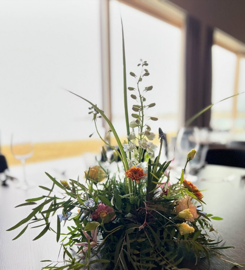 Luna Studio flower arrangement with green plants on the table