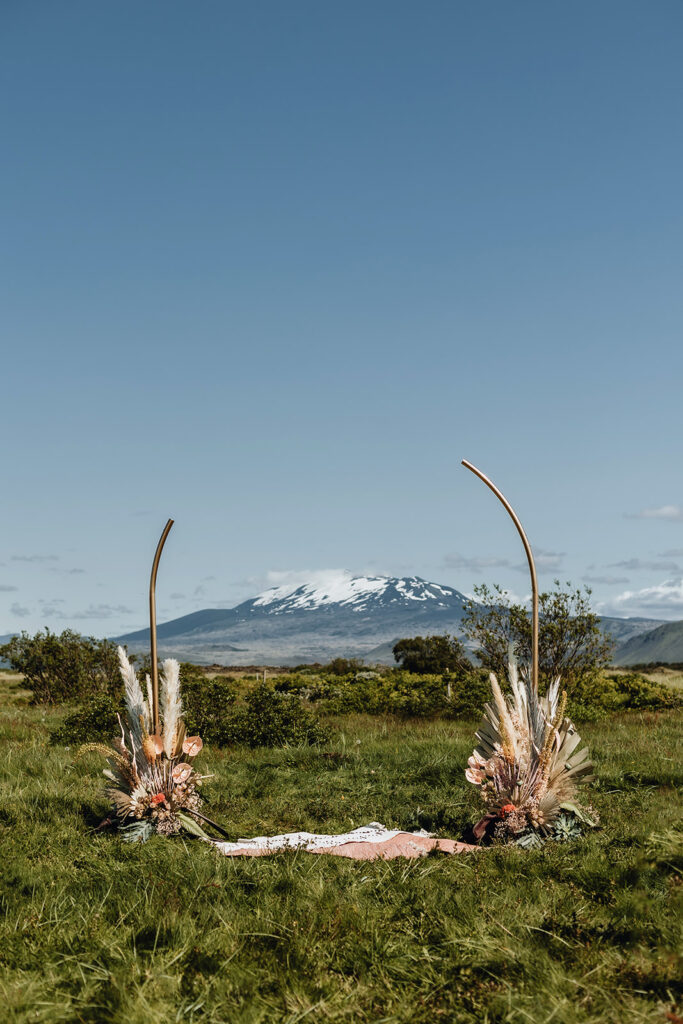 Wedding flower arrangement outside with mountains in the background